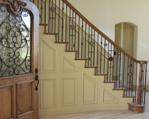 House of Forgings Open Rake Staircase: Custom Mix of 3 Baluster Types and Medallion Inserts from the Versatile Square Collection, Wooden Turned Newel Post, Wooden Handrail with Volute, Miter Returned Treads